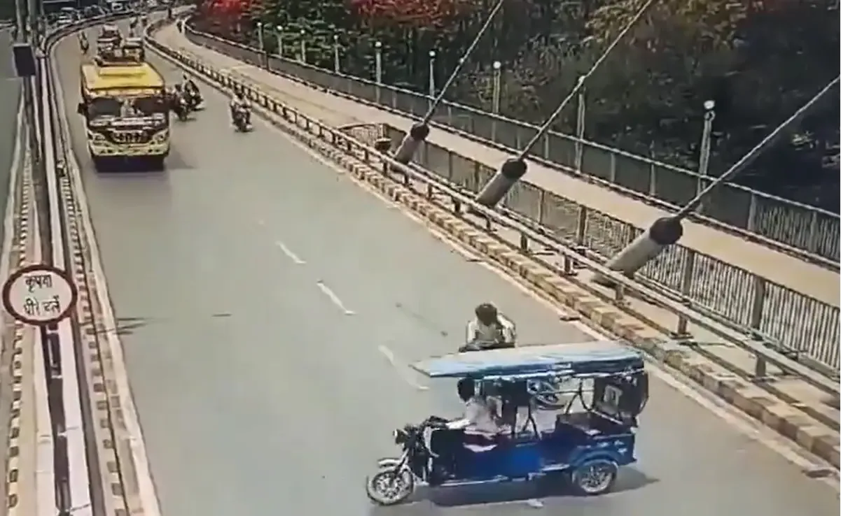 a group of people riding a e rickshaw on a road